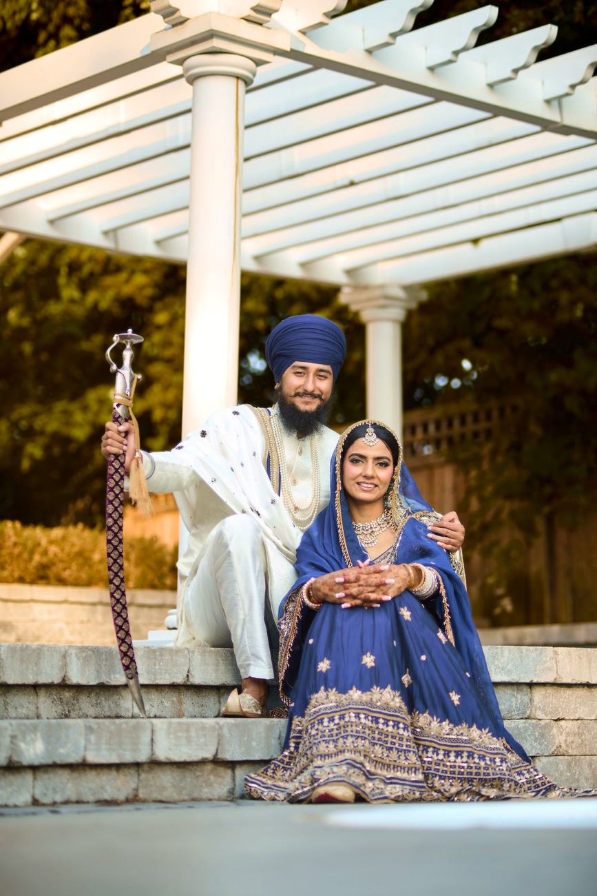 Couple beneath a garden pergola